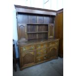 A George II oak dresser, 192cms h, 153cms w, 45cms d