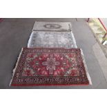 Three assorted rugs