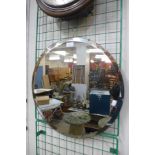 A circular bevelled edge mirror, 53cms d