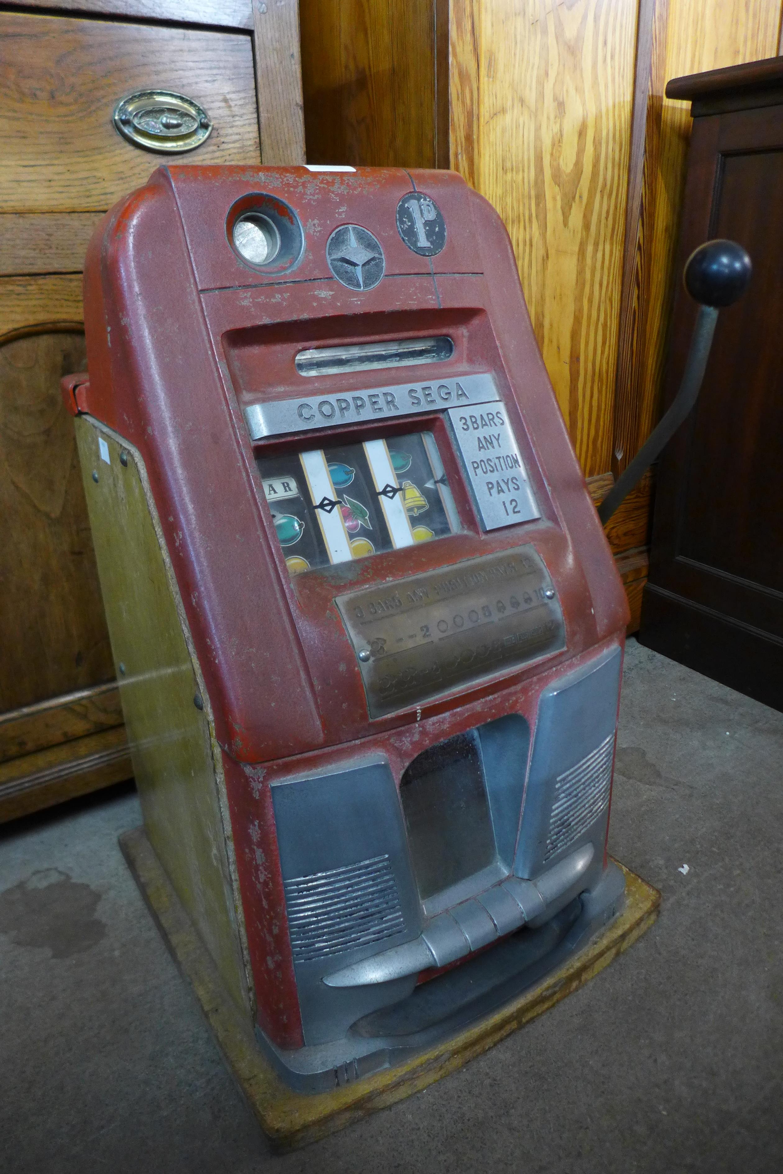 A vintage Copper Sega one arm bandit fruit machine