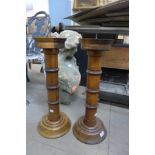 A pair of large French oak candlesticks