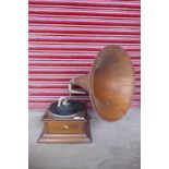 A vintage oak HMV gramophone, with oak horn speaker