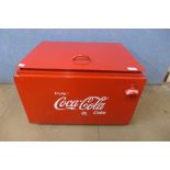 A Coca-Cola metal cooling box