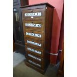 A hardwood apothecary seven drawer cabinet, 140cms h x 55cms w