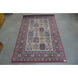 A red ground rug, 193 x 135cms