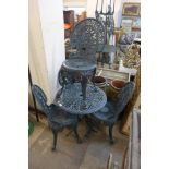 A painted cast alloy garden table and four chairs