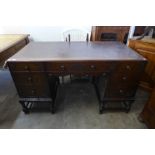 An early 20th Century carved oak barleytwist desk, 78cms h, 138cms w, 69cms d