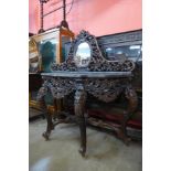 An eastern carved hardwood console table, 130cms h x 131cms w