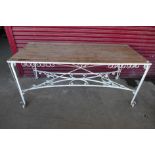 A large French style pine and wrought steel garden table