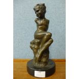 A bronze figure of a boy, on black marble socle, 29cms h