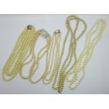 Five faux pearl necklaces