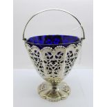 A Victorian silver sugar basket with blue glass lining, Sheffield 1854, Henry Wilkinson & Co., 224g