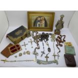 A collection of religious items; a figure, six rosaries, Sunday School miniature story booklets,