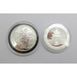 A 2011 Fiji 1oz. fine silver turtle 2 dollars coin and a 2005 China 1oz. fine silver panda coin