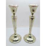 A pair of silver candlesticks, 19.5cm