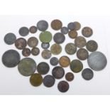 A collection of old bronze coins including farthings and third farthings