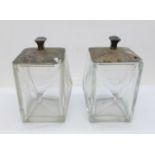 A pair of silver topped glass preserve pots, Birmingham 1935, Goldsmiths & Silversmiths Co. Ltd., (