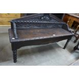 A Victorian Jacobean Revival carved oak hall seat, 69cms h, 121cms w