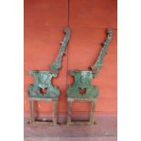 A pair of large 19th Century Coalbrookdale style cast iron bench ends