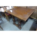 An oak draw-leaf table