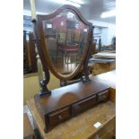 A George III mahogany shield shaped toilet mirror