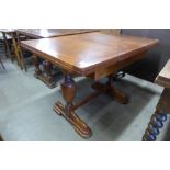 An oak draw-leaf table