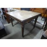 An oak draw-leaf table