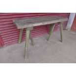 An early 20th Century solid oak garden table