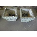 A pair of concrete garden planters