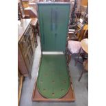 A Victorian mahogany folding bagatelle board