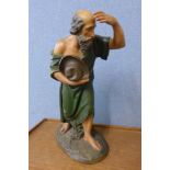 A continental carved wood ecclesiastical figure of a man, 61cms h