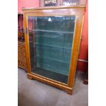 A Victorian style amboyna and parcel gilt vitrine, 147cms h, 103cms w, 34cms d