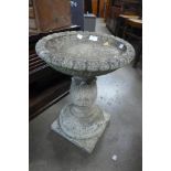 A concrete bird bath