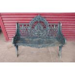 A Coalbrookdale style cast iron peacock design garden bench