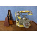 A vintage telephone, metronome, etc.