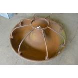 A cast iron Mexican hat pig feeder