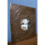 An Arts and Crafts embossed copper mirror, 35 x 28cms