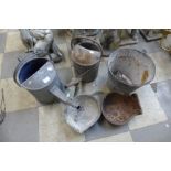Two galvanised watering cans, bucket and two small troughs