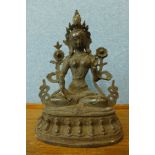 An oriental bronze figure of a seated deity, 30cm h