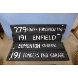 Four painted wooden street signs