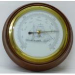 A circular wall barometer, made in Germany