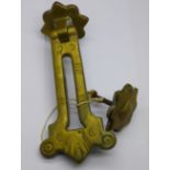 A brass door knocker/letter box