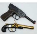A Luger toy pistol and table lighter flintlock pistol