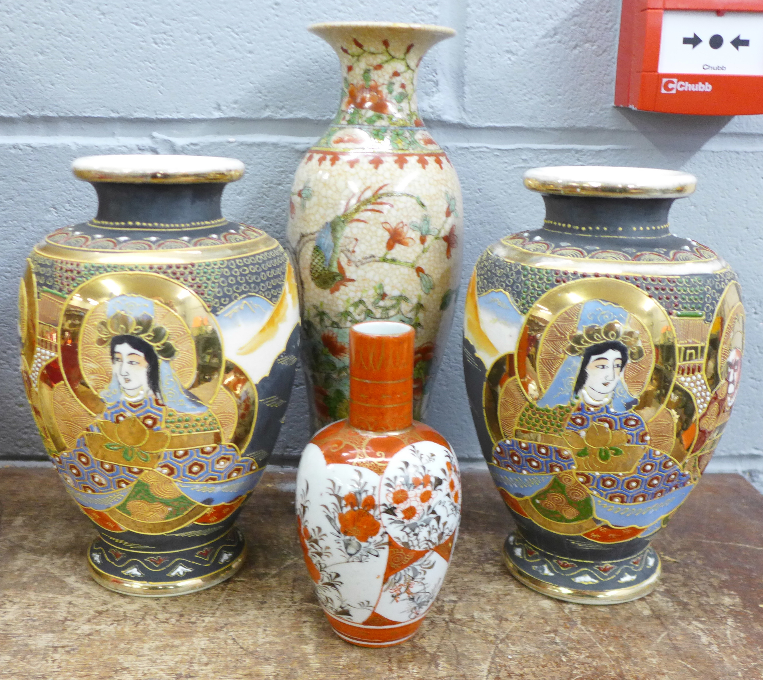 A pair of Japanese vases and two other Japanese vases