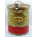 A glass jar of Cuban cigars, Fabrica de Tabacos De H. Upmann, "Nature-Seasoned" cigars, (glass