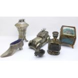 Two novelty table lighters, two pin cushions, (chick a/f), a match holder and a gilt metal and