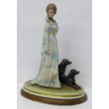 A Neapolitan figure of a lady with two dogs, signed B. Merli '74, 35cm