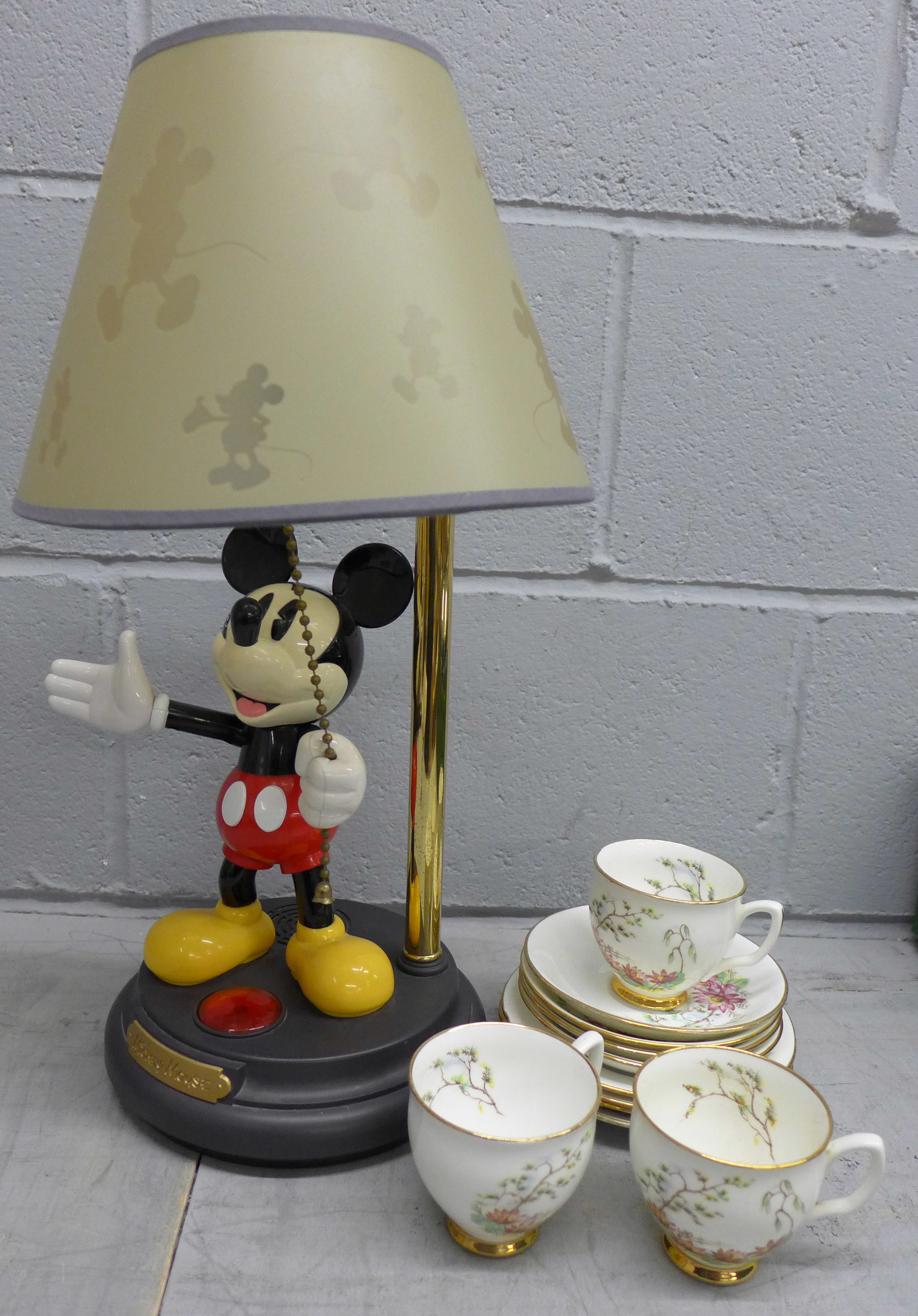 A Crown Trent bone china set of three cups, four saucers and plates plus a Mickey Mouse lamp **