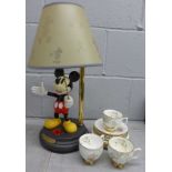 A Crown Trent bone china set of three cups, four saucers and plates plus a Mickey Mouse lamp **