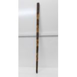 A Spanish walking cane with bullfight carvings